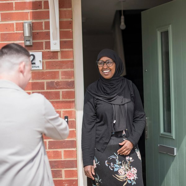 Woman Doorway Smiling