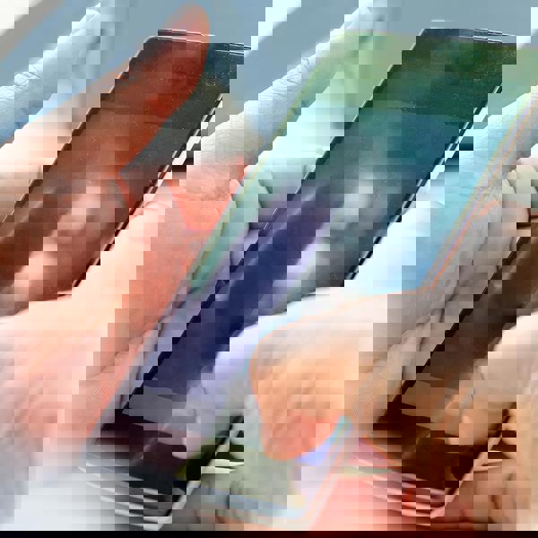 A close-up of someone holding a smartphone