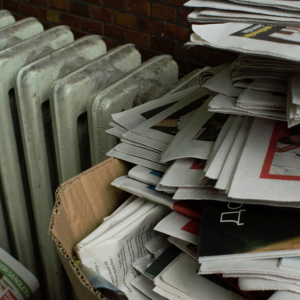 An untidy stack of newspapers