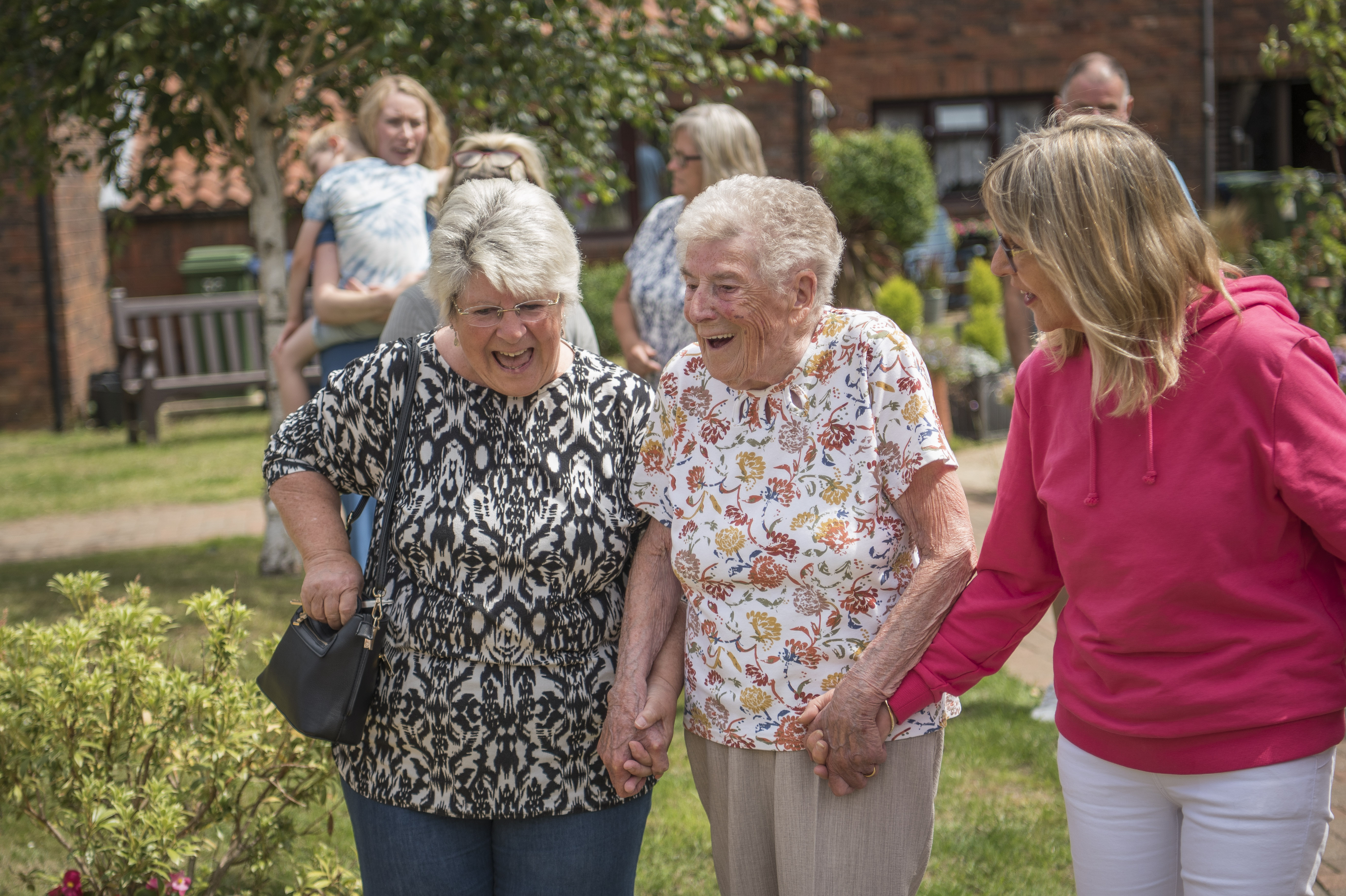 Group Of Older Women In Garden Laughing