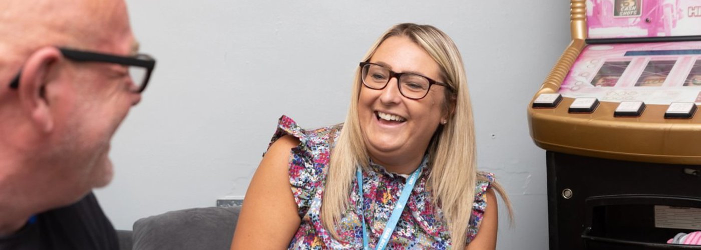 Housing Partner Maxine Laughing With Customer